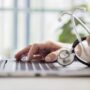 Doctor checking patient data on a laptop