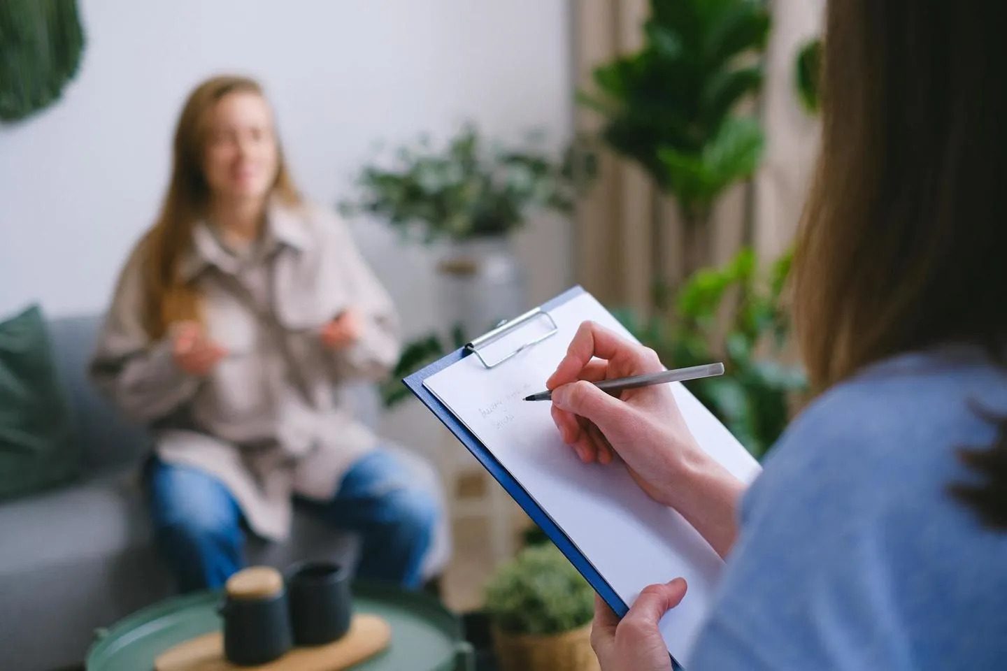 patient talking to doctor taking notes